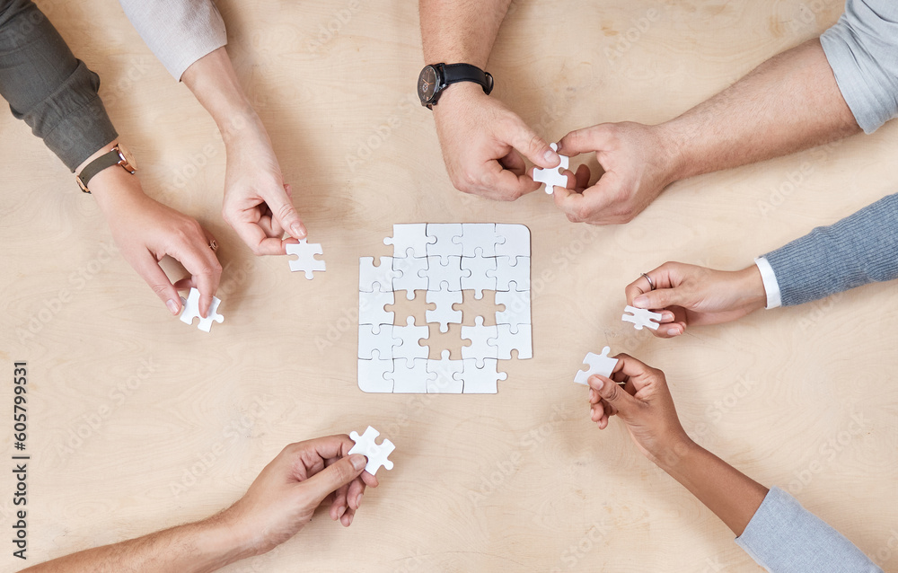Poster Puzzle, hands and office group with planning and problem solving at a table. Above, teamwork and company employee team with strategy, collaboration and connection process for decision and solidarity