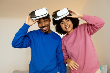 Happy Black Spouses Posing With VR Glasses At Home