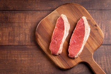 Raw picanha steak on the cutting board.