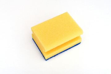 Yellow sponge for dishwashing and other domestic needs isolated on the white background