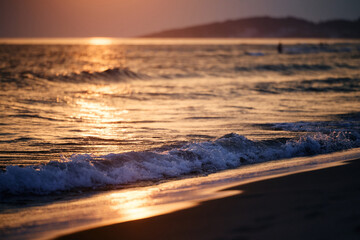 Fototapeta na wymiar Sea waves on summer sunset.