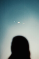 silhouette of a person with a plane