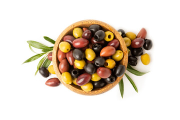 Bowl with olives isolated on white background. Delicious black, green and red olives with leaves in plates on a white background. Fresh olive fruits.