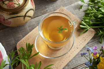 Catchweed tea in a cup