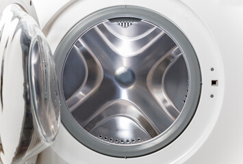 Inside of washing machine. Rotating inner tub. Material metal. Close-up of electrical household...