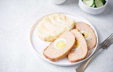Fototapeta na wymiar Chicken meatloaf with eggs in a plate