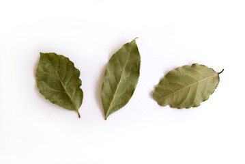 Dry fragrant bay leaves on a white background. Spice for cooking. healthy organic food. Bay tree...