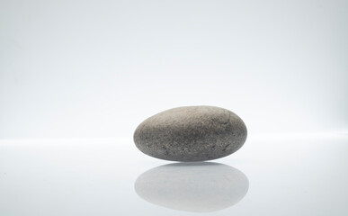 Fototapeta na wymiar stones on white background for product presentation podium