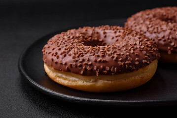 Delicious chocolate glazed donut sprinkled with chocolate chips