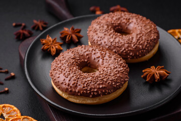 Delicious chocolate glazed donut sprinkled with chocolate chips