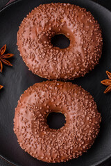 Delicious chocolate glazed donut sprinkled with chocolate chips