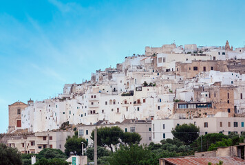 Panoramic view of Ostuni - white town in Puglia, South Italy (Brindisi province). People unrecognizable.