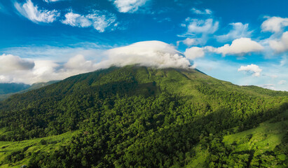 Amazing view of beautiful Arenal volcano in Costa Rica. Panorama of volcano Arenal reflected on wonderful picturesque lake, La Fortuna, Costa Rica. Central America.