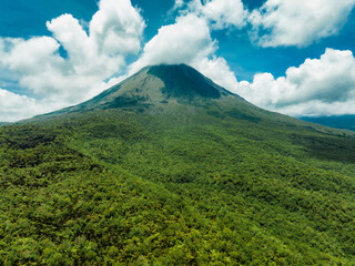 Amazing view of beautiful Arenal volcano in Costa Rica. Panorama of volcano Arenal reflected on...