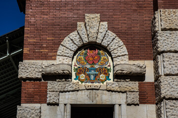 Detail of mosaic decorated facade of historic Columbus market (Mercado de Colon). VALENCIA, SPAIN.