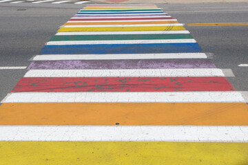 LGBTQI pride pedestrian crosswalk rainbow colors, copy space.