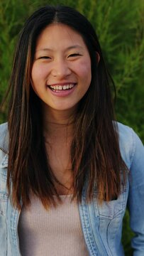 Portrait of happy Asian girl smiling.