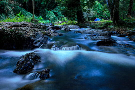 camping tent and beautiful landscape of klong lan water fall national park in northern of thailand