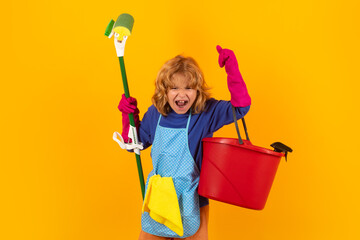 Kid helping with housework, cleaning the house. Cleaning accessory, cleaning supplies. Studio...