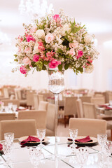 a glass vase with pink and white flowers