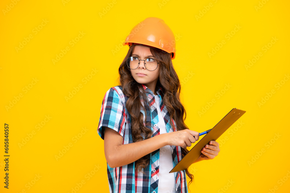 Poster thinking pensive clever teenager girl. teenager child painter in helmet with clipboard. child in har