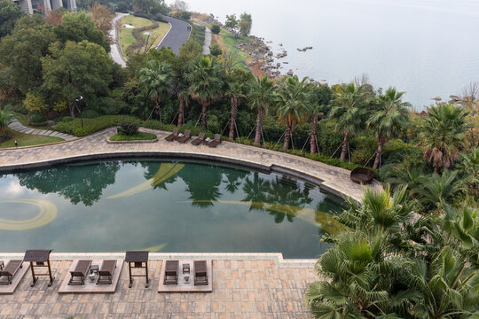 Suzhou, China - November 22, 2019: Aerial view of East Taihu or Tai Lake and swimming pool of East Taihu Hotel with reflection in Wujiang District, Suzhou. Third largest fresh-water lake in China.