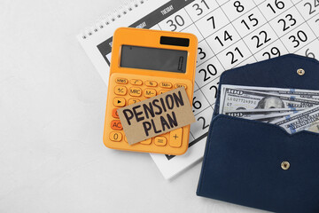 Card with phrase Pension Plan, dollar banknotes, calculator and calendar on white table, flat lay