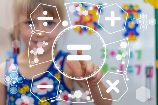 Little girl using virtual touch screen sees mathematical operations symbols of plus, minus, multiply, divide and clicks sign: equal. Concept of school education, business, math or calculation.