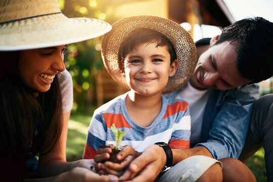 Portrait of happy family, soil or plants in garden for sustainability, agriculture or farming development. Mother father or parents hands holding sand or planting for teaching a child farming skills