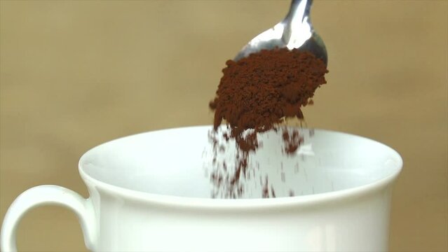 Pouring coffee in to a cup slow motion
