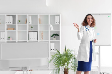 Portrait of young female doctor  in clinic