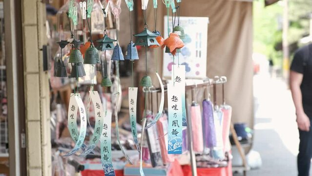 Decorative japanese bell wind chime or furin at a shop in a warm summer day in Kyoto, Japan.