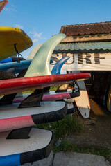 Canggu, Bali, Indonesia Surfboards piled onto a truck at the beach.