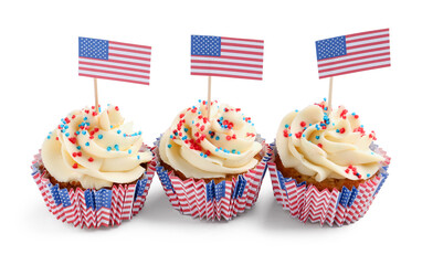 Tasty patriotic cupcakes and flag of USA on white background. American Independence Day