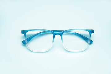Fototapeta premium New gradient eyeglasses on pale blue background