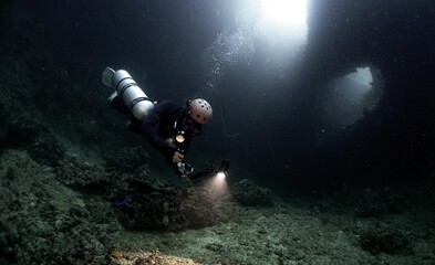 scuba diver in a cave