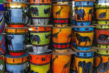 Fototapeta premium Coffee cups or mugs with colorful animal wildlife, Cape Town, South Africa.
