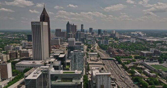 Atlanta Georgia Aerial v826 cinematic drone flyover Midtown along side Interstate 85 highway towards Georgia Tech campus capturing the views of downtown cityscape - Shot with Mavic 3 Cine - May 2022