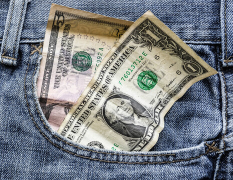 american dollar. money is in the pocket of blue jeans
