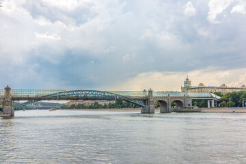 View of the Moscow river embakment, Pushkinsky bridge and cruise ships at sunset.