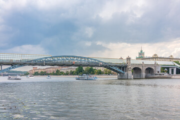 Fototapeta premium View of the Moscow river embakment, Pushkinsky bridge and cruise ships at sunset.