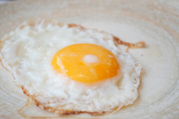 Fried eggs in the plate close up ,