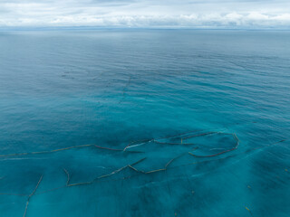 Top view of stationary fishing net over the sea