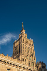 Fototapeta na wymiar The Palace of Culture and Science Beautiful architecture of Warszawa city center with Palace of Culture at sky background. One of the main symbols of Warsaw skyline. Travel destinations tourist