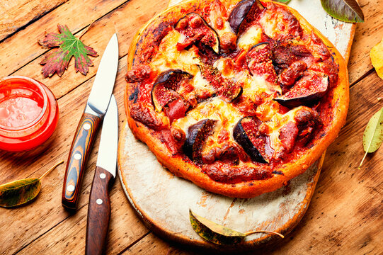 Meat pizza with figs.