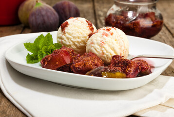 Dessert with pickled figs and vanilla ice cream scoops