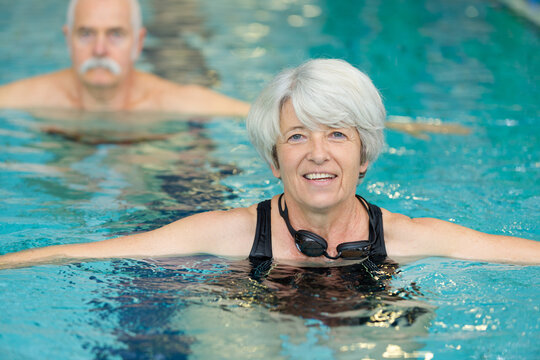 healthy active senior woman swimming in the pool