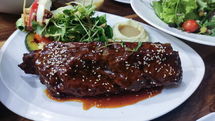 Close up photo of Pork Rib Steak on white plate