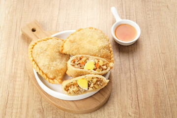 Jalangkote, Indonesian traditional snack filled with egg, carrot, potato, rice noodles. Served with chili sauce
