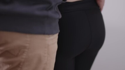 Male Hand touching sexy boots of woman at home, close up